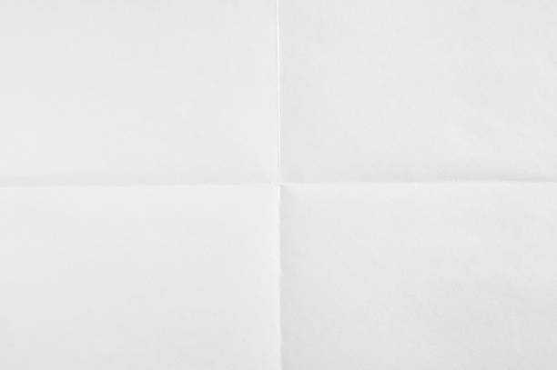 istock White blank sheet of paper folded in four. White crumpled paper texture background. 1165112638
