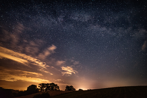 The sky displays a beautiful orange hue during sunrise or sunset.