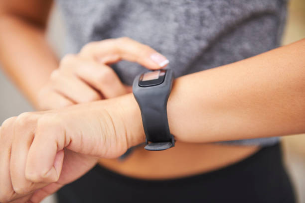 istock Woman checking how many calories she burned 1165113060