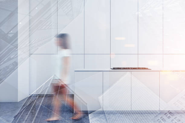 istock Woman walking in white kitchen with island 1165113776