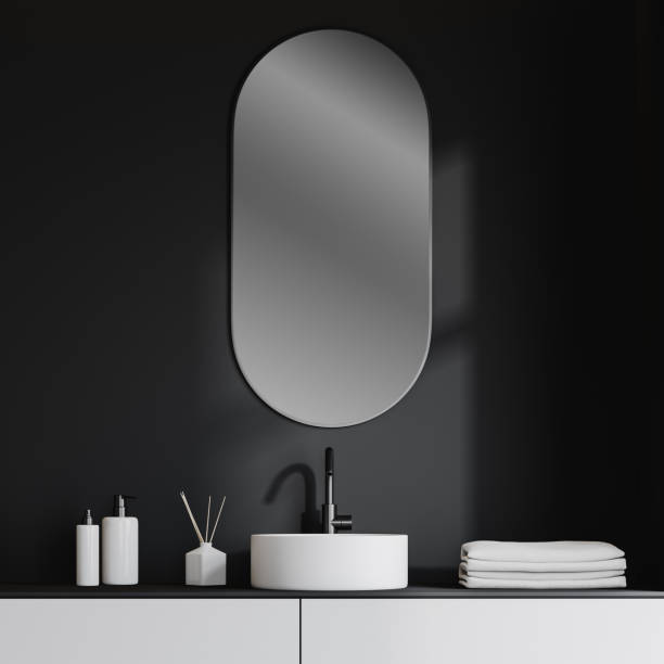 istock Bathroom sink in dark gray room 1165113849