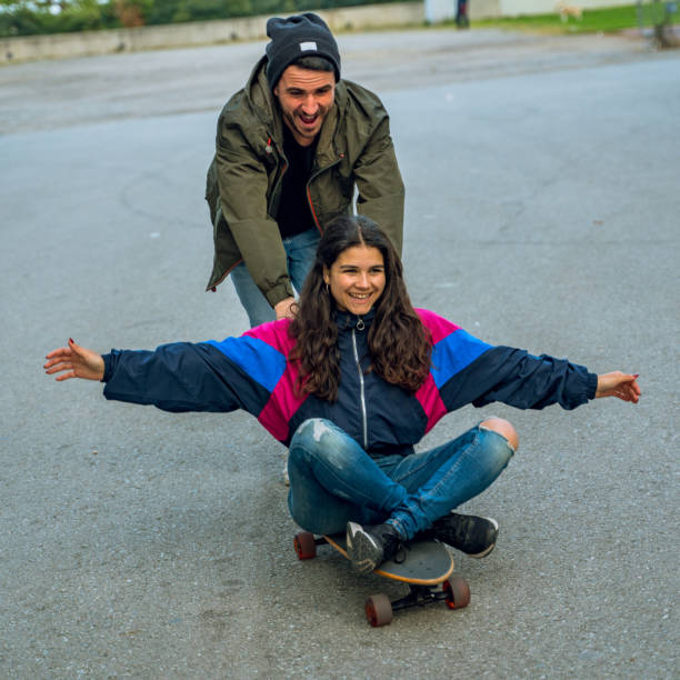 istock Having fun together with a longboard in Barcelona 1165114564