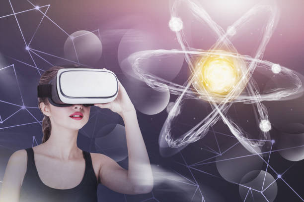 istock Young woman in VR glasses, atom hologram 1165115345