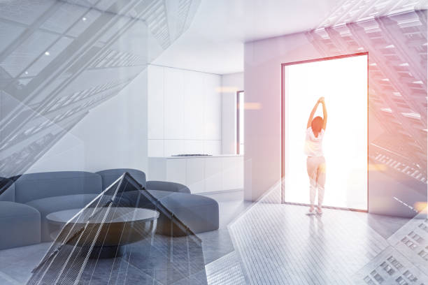 istock Woman in white living room and kitchen 1165115627