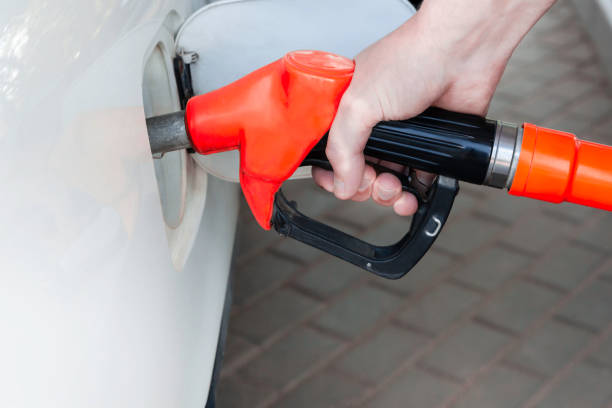 istock Refueling white car at the refuel station. 1165117583