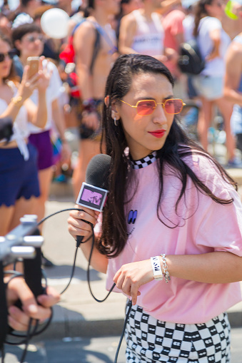 Tel Aviv, Israel - June 8, 2018: MTV crew reporting from Tel Aviv Pride Week.At the parade, people walking, dancing, singing, waving banners and rainbow flags celebrating the largest LGBT event in the middle east.