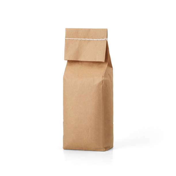 istock Brown craft paper bag with stitch sewing isolated on white background. 1165124689