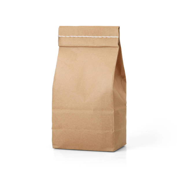 istock Brown craft paper bag with stitch sewing isolated on white background. 1165124748