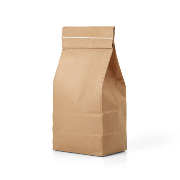 istock Brown craft paper bag with stitch sewing isolated on white background. 1165125459