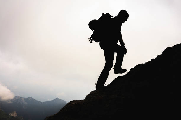 istock Alpinists ascend along a mountain crest 1165125505