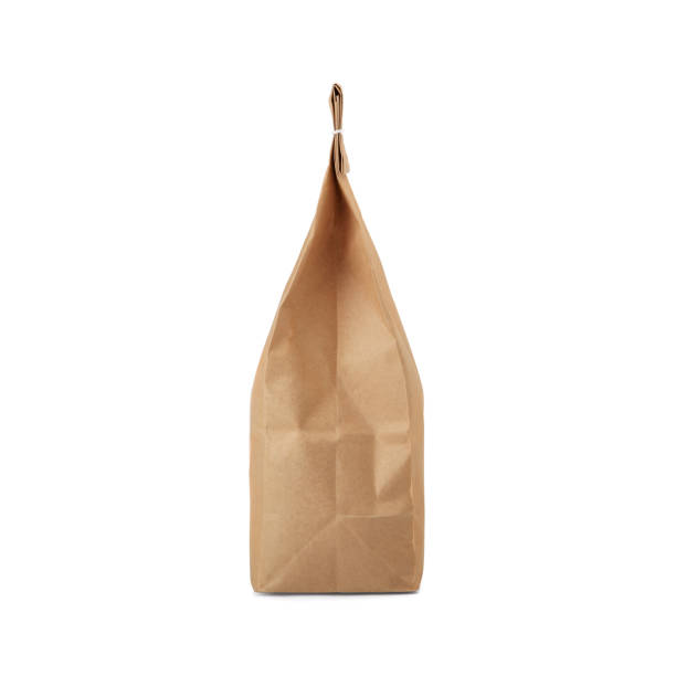 istock Brown craft paper bag with stitch sewing isolated on white background. 1165125570