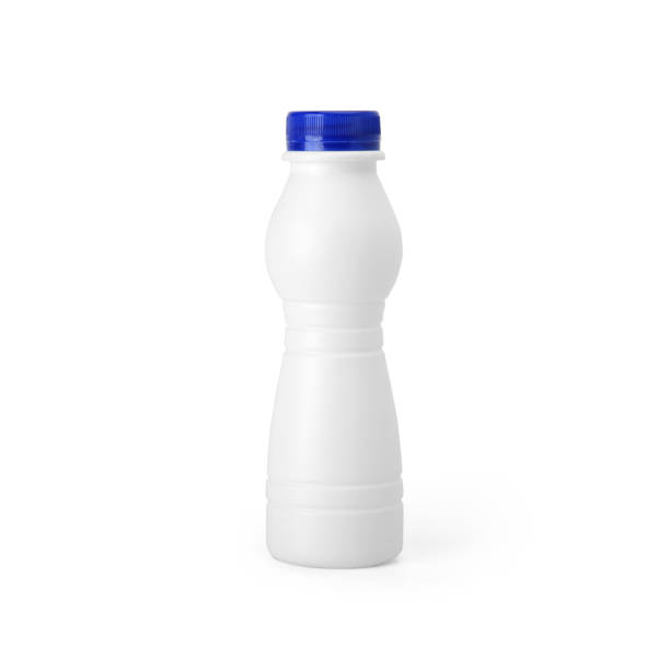 istock White plastic yogurt milk bottle with blue lid isolated on white background. 1165125633