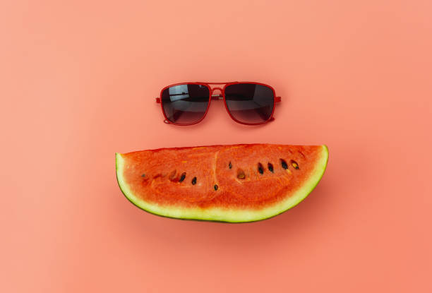 istock Fruit tropical with spring summer holiday & vacation background concept.Arrangement sliced watermelon & sun glasses on modern pink paper.Minimal style with pastel tone.Copy space for text & word. 1165126174