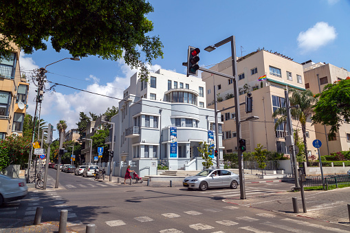 Tel Aviv-Yafo, Israel - June 12, 2018: Urban view from the famous Rothschild Boulevard in Tel Aviv. The Boulevard is a popular central meeting point for locals and visitors.