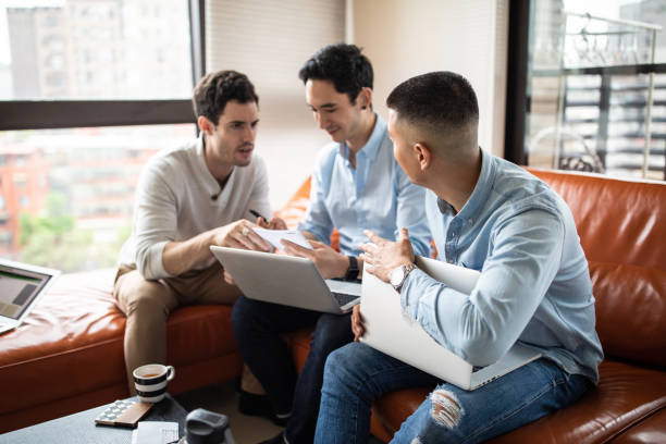 istock Male group of business people cooperating on project 1165133475
