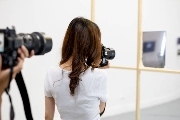 istock Beautiful girl photographer 1165136006