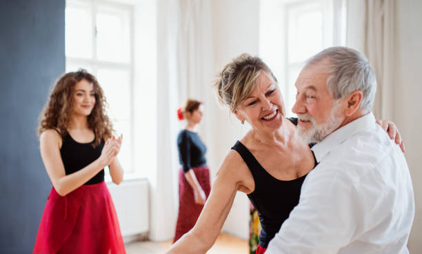 istock Group of senior people in dancing class with dance teacher. 1165137940