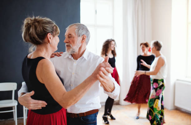 istock Group of senior people in dancing class with dance teacher. 1165137963