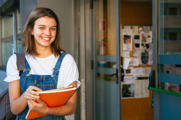 istock Cheerful student girl about to enter class 1165138701