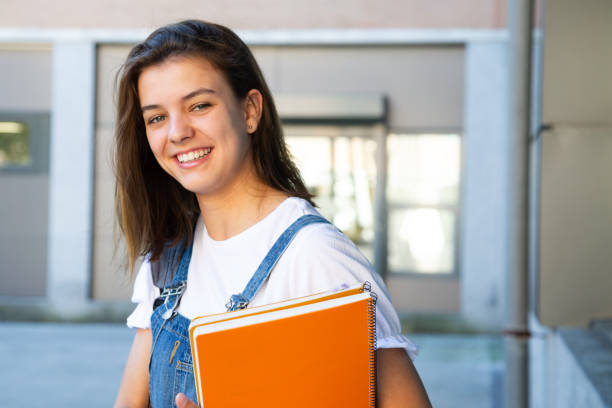 istock Happy student girl portrait 1165138705