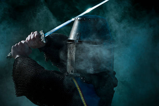 istock A medieval knight wearing uniform holding sword 116514177