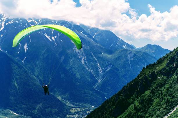 istock Flying on a paraglider. Chamonix France. 1165142286