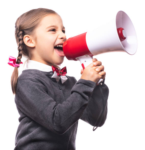 istock Child Girl Student Shouting Through Megaphone Isolated on White Background. Back to School Concept. 1165142292