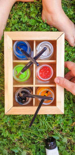 istock Water colors in jars on the grass 1165143908