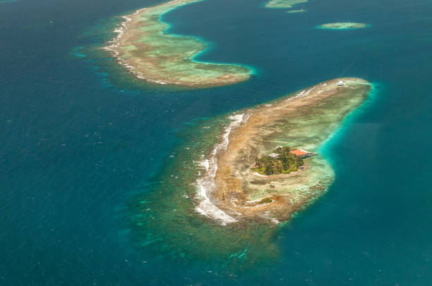 istock Atoll with two homes, Guanaja, Honduras 1165145916