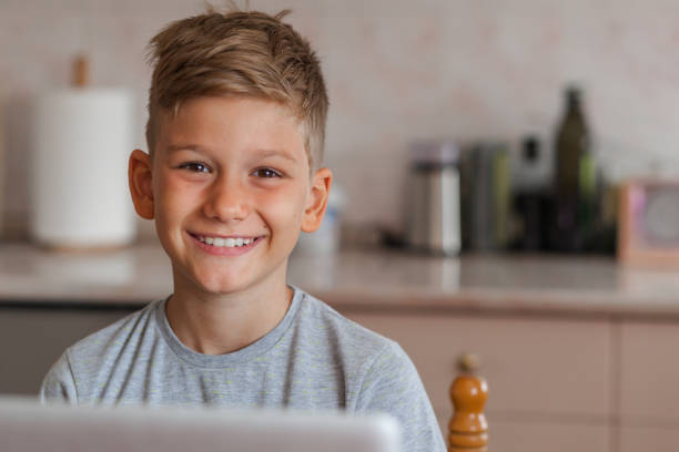 Portrait of a cute smiling boy looking at camera Portrait of a cute smiling boy looking at camera 8 9 years stock pictures, royalty-free photos & images