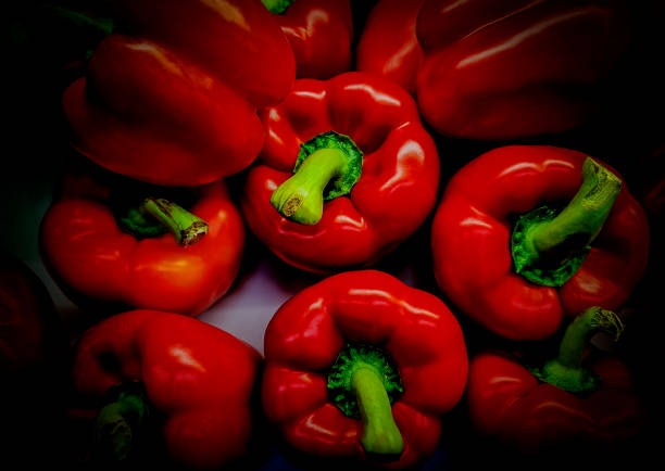 Food and drink A display of red bell peppers in a vegetable market common rudd photos stock pictures, royalty-free photos & images