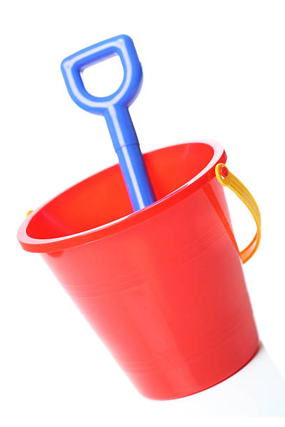 holiday fun red bucket with spade sand pail and shovel stock pictures, royalty-free photos & images