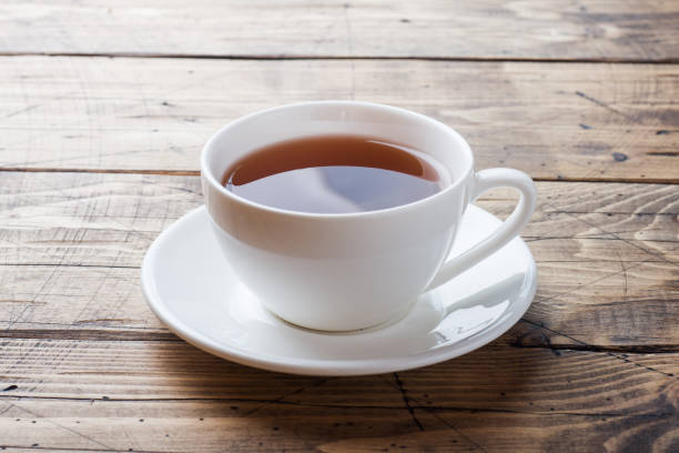 istock Cup with chicory drink and blue chicory flowers on wooden table. Copy space. 1165153369
