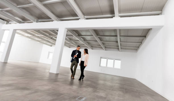 istock Businesspeople Meeting To Look At Plans In Empty Office 1165157461