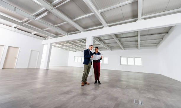 istock Businesspeople Meeting To Look At Plans In Empty Office 1165157549