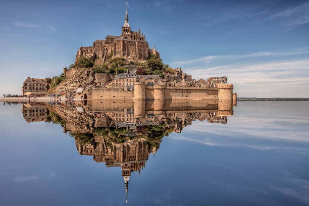Mont St Michel in daytime Mont Saint Michel, an UNESCO world heritage site in Normandy, France abbey monastery photos stock pictures, royalty-free photos & images