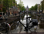 Amsterdam, Holland: Vintage black bikes parked above canal