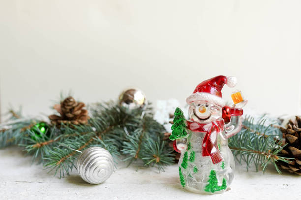 istock Christmas decoration and snowman on white background with copy space. celebration greeting card 1165161359