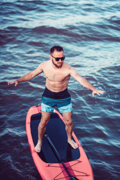 istock Keeping Balance On A Paddle Board Can Be Hard 1165170086