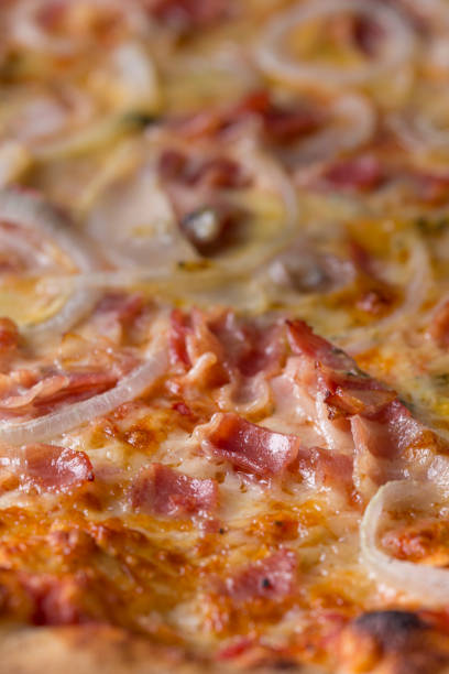 istock Pizza with bacon and cheese close up still 1165170663