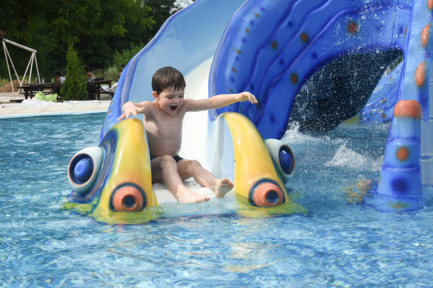 istock Little boy play swimming and playing in the pool 1165170747