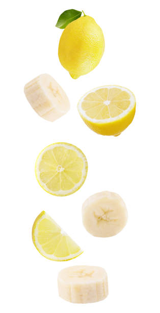 istock floating isolated on white background lemon fruits and bananas 1165170757
