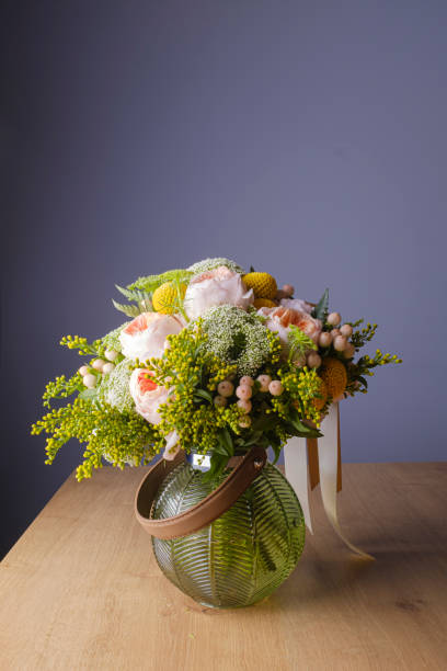 istock Beautiful flower bouquet on a grey blue background 1165171410