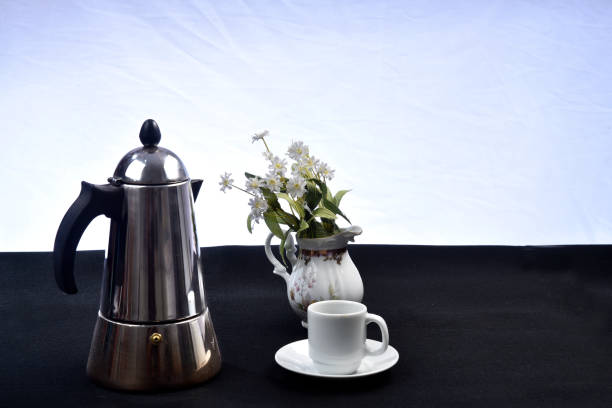 istock cup of coffee with coffee maker on the table seen from above 1165173263