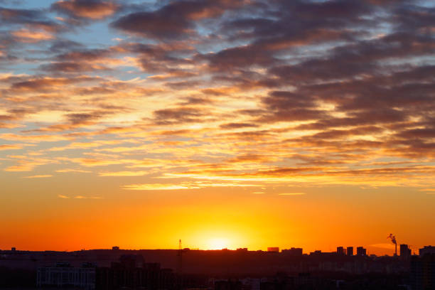 istock Urban landscape with sunset, cirrus clouds and buildings 1165174071