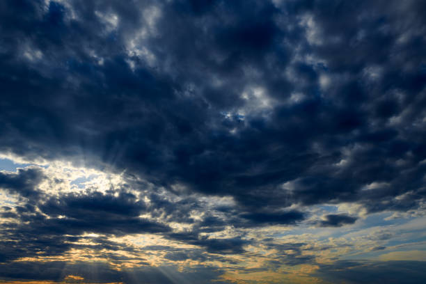 istock Beautiful sunset - dark sky with clouds and sunlight 1165177343