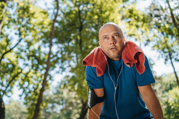 istock Mature man catching a breath after run 1165177707