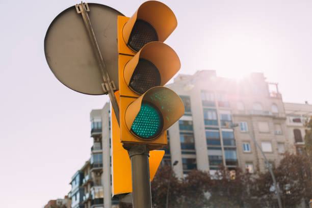 istock selective focus of traffic light with multistory house on background, barcelona, spain 1165180390