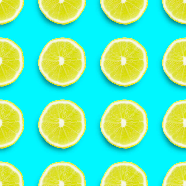 istock seamless texture, lemon sliced ​​into rings on a colored background 1165182474