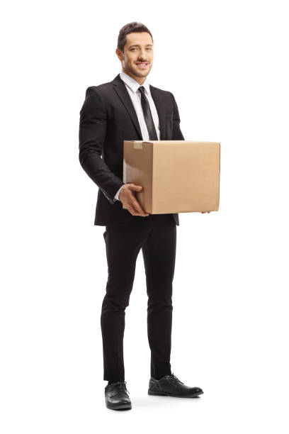 Man in a suit holding a cardboard box